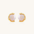 Gold-plated sterling silver stud earrings with organic claw settings cradling lustrous freshwater pearls on white background.