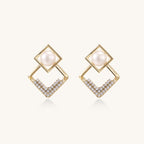 Gold-plated geometric drop earrings with freshwater pearls in square frames and crystal-accented diamond-shaped dangles